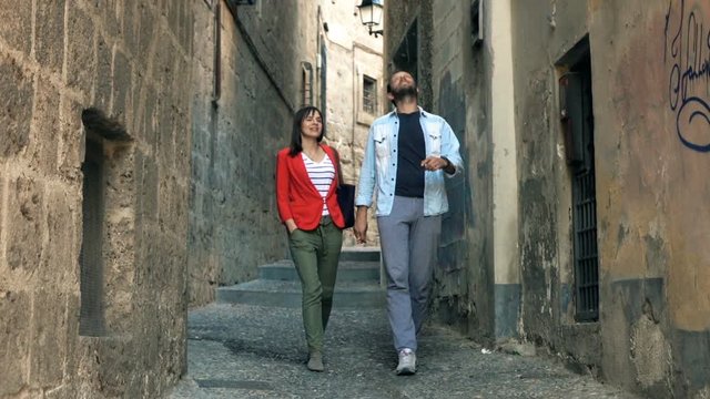 Happy couple talking and sightseeing old town, super slow motion 120fps
