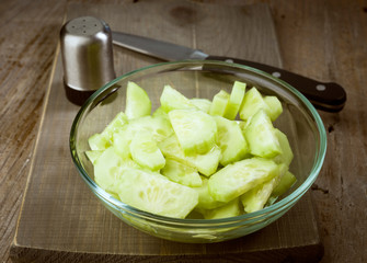 cucumber salad bowl on wooden