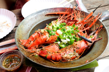Baked prawns in pot on a table  