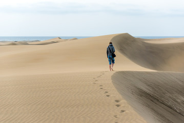 Men walking in the desert of gran canaria, spain
