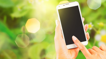 Women holding Smartphone - Summer background close up 