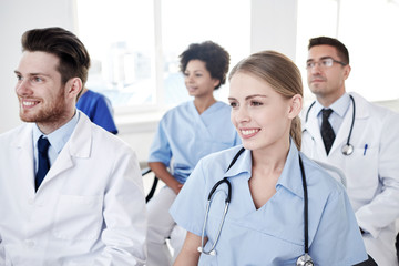 group of happy doctors on seminar at hospital