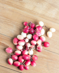 carunda fruit on wooden background