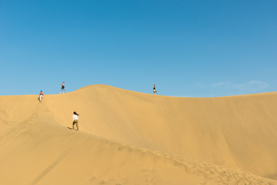 People walking through the desert