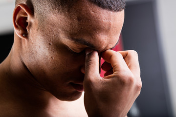 closeup portrait of a man with an headache