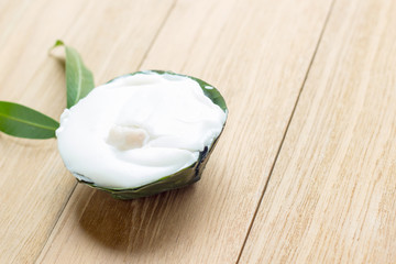 pudding with coconut topping on wooden board