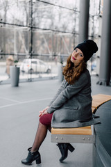 Young woman sitting in office buinding