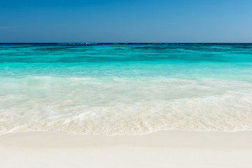 Fototapeta na wymiar Beautiful beach and tropical sea, Wave of the sea on the sand beach