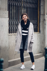 Modern wearing woman walking on the street