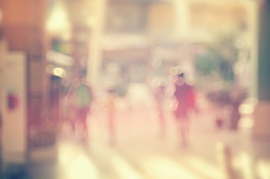 Blur people walking in shopping center mall abstract background.