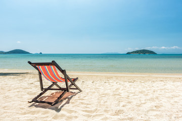 Beach chairs on the white sand beach, Beautiful beach and tropical sea, Wave of the sea on the sand beach