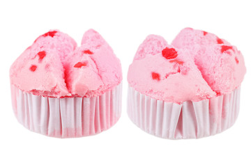 Two pink cupcakes isolated on white