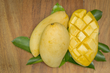 mango on a dark wood background. tinting.