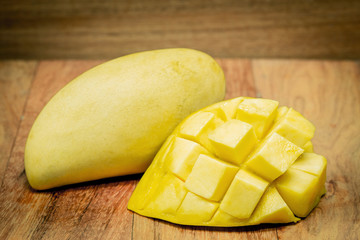 mango on a dark wood background. tinting.