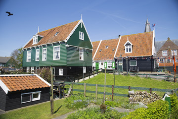 Fototapeta na wymiar Old fishing green cottages on the island of Marken