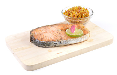 Fototapeta na wymiar Salmon steaks,Turmeric rice in glass bowl,wooden Cutting Board o