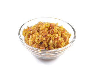 Turmeric rice in glass bowl on white background.