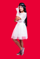 bride posing with a bowler hat