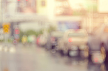Blur traffic road with bokeh light abstract background.