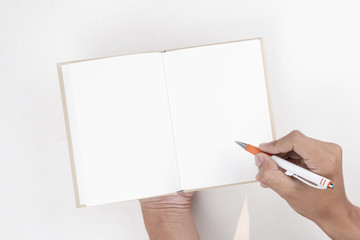 hand writing on blank notebook