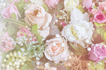 Soft focus artificial orange and white rose flowers bouquet