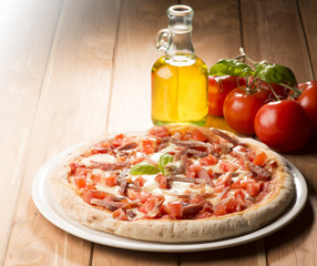 Pizza with bacon on the wooden table