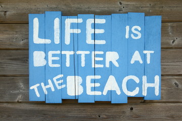 Fototapeta premium sign/ self made sign saying that life is better at the beach