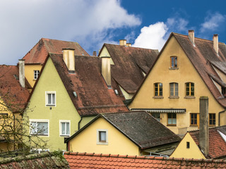 Fototapeta na wymiar Urban landscape with an ancient houses and a tiled roofs. Rothenburg, Bavaria, Germany.