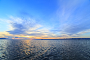 the sky and water at dawn