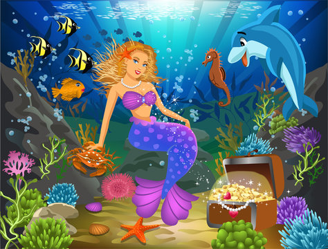 mermaid sitting on a rock underwater surrounded by fish