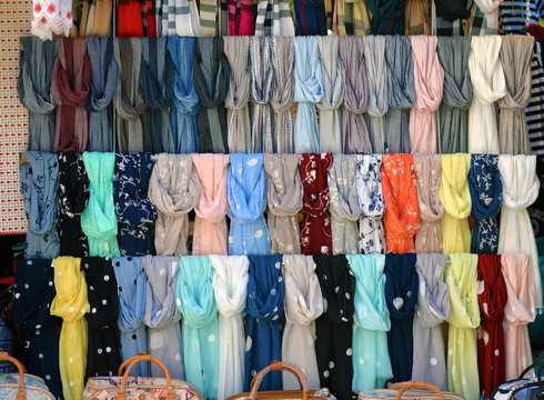 scarves on a store window. Street trading