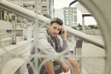 Outdoors portrait of a urban young man with headphones