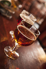 Two glasses of draught beer.