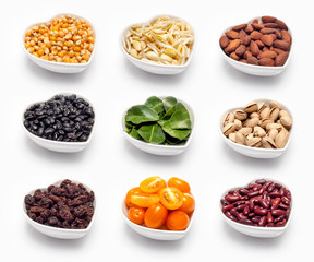 variety of ingredients in a heart shaped bowl, isolated on white.
corn, fresh soya, roasted almonds, black beans, bergamot, pistachio, raisins, plum tomato, red bean,