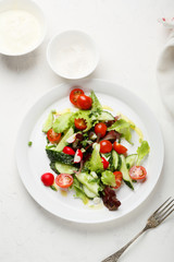 summer salad on white plate