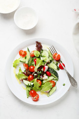 fresh and healthy salad with dressing