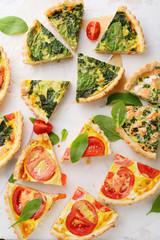 slices quiche with fish and spinach