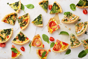 slices of pies with spinach and salmon