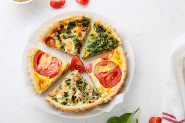 slices of pies with vegetables on plate