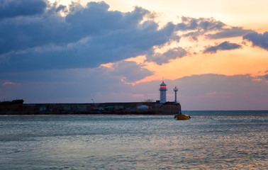 Obraz premium Old pier to the lighthouse in Yalta, Crimea