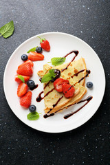 crepes with fresh berries and sauce