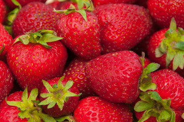 Fototapeta na wymiar Background from freshly harvested strawberries