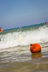 Obraz premium The Orange Buoy in the Blue Sea, Close-up