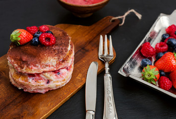 homemade tiramisu with berry fruits and vintage silverware
