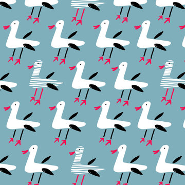 Seamless pattern of funny seagulls on blue background. Hand draw