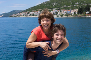 Fototapeta na wymiar Happy mother and son at the beach