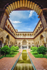 Beautiful traditional garden of Seville royal palace, in Andalusia - Spain - obrazy, fototapety, plakaty