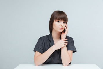 Casual woman sitting at the table