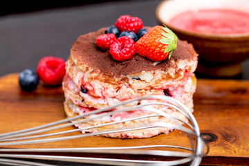 homemade tiamisu with custard cream and berry fruits