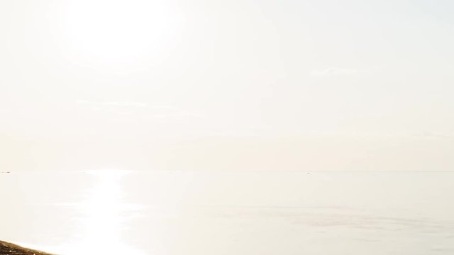 paning sunset timelapse over fin gulf baltic sea with small clouds and volumetric light, prores footage